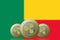 3D ILLUSTRATION Three RIPPLE cryptocurrency with Benin flag on background