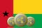 3D ILLUSTRATION Three RIPPLE cryptocurrency with Guinea Bissau flag on background