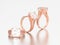 3D illustration three rose gold engagement diamond rings