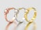 3D illustration three yellow, rose and white gold or silver three stone diamond rings