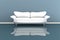 3d illustration of a white sofa in a grey room