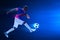 3d illustration young professional soccer player kicking ball on dark blue backgrounds