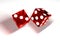 3d image: high quality rendering of transparent red rolling dices with white dots. The cubes in the cast. throws. High resolution.
