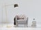 3D living room interior with grey armchair, wooden floor lamp and pile of books. White interior with a white wall background.