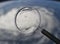 3d magnifying glass with hurricane view from space. Elements of