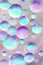 3D modeling multicolors bubbles. Colorful blue, pink, mint and purple background. Artistic strikes. Rays of light.