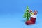 3d paper Santa boot with gifts and origami christmas tree