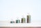 3d Percentage icon and colorful rise up arrows on coin stacked bar graph chart steps on white background.