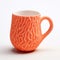 3d Printed Orange Ceramic Mug With Textured Expressions