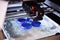 The 3D printer prints the details of the blue plastic.