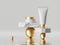 3d render, abstract skin care cosmetics presentation. White cream tube and jar with golden caps placed on rough cobblestone.