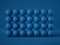 3d render, abstract wall of many balls isolated on blue background, balance concept. Matrix of geometric primitive shapes.