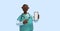 3d render, african young man, nurse cartoon character wears mint green shirt, holds smart phone with blank screen. Hospital