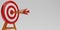 3D render Arrow hit the center of the target on a dartboard on white background. Minimal target with arrows. Business finance