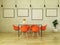 3D render of beautiful dining table with orange chairs