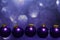 3d render of beautiful flying dark purple Christmas baubles on a purple bokeh lights background