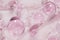 3d render of beautiful pink droplets of face serum for your beauty project