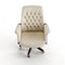 3D render of a beige chair with arms and an armrest