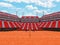 3D render of beutiful modern tennis clay court stadium with red seats