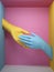 3d render, blue yellow hands isolated on pink background, female mannequin body parts inside box, handshake, minimal fashion