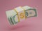 3D render Bundle cash is falling on pink background.Floating US Dollar bills bundles stack icon. Minimal style money dollar cash