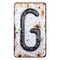 3D render capital letter G made of forged metal on the background fragment of a metal surface with cracked rust.