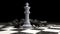 3d render of chess pieces on the board. The White King surrounded by defeated black pieces. Business concept