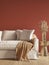 3d render of a dark red living room with a beige linen sofa and dried flowers