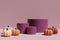 3d render of different shades of orange pumpkins with purple round podiums on a mauve background