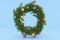 3D Render. Empty Christmas wreath on Light Blue Background