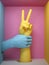 3d render, feminist protest concept, female hand victory sign gesture, mannequin body parts isolated on pink background