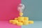 3d render financial investment concept with light bulbs and money on pink background.Minimal design ,flat lay