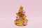 3d render of gold artificial Christmas tree with pink and gold baubles on a pastel pink background