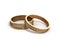 3d render Gold wedding rings engraved on white