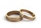 3d render Gold wedding rings engraved on white