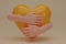 3D render hands hugging a yellow heart with love. Hand embracing white heart isolated on yellow background. Love yourself. used