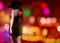 3d render illustration of sexy spy lady in black dress on city lights backdrop