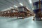 3D render Industrial racks, pallets, boxes, shelves with goods in huge storage rooms. Warehouse equipment, automotive warehouse,