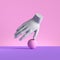 3d render, mannequin hand, ball equilibrium. Balance metaphor, gesture, isolated on pink background, minimal fashion concept