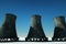 3D render Nuclear power plant against the background of nature, cooling tower towers nuclear fusion clean energy. Copy space