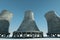 3D render Nuclear power plant against the background of nature, cooling tower towers nuclear fusion clean energy. Copy space