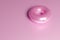 3d render of pink metallic donut on a monochrome pink background