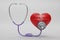 3D render red heart with a medical stethoscope isolate on white background. Blood pressure control. Heart and heartbeat.