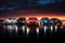 3D render of a row of cars on the road at sunset, a lineup of iconic and luxurious vehicles, AI Generated