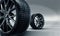 3d render of rubber tires on cast steel rims. Wheel sale concept. Auto repair shops