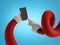 3d render, Santa Claus flexible hands in red sleeves with white fur hold black mobile phone device, blank card, wireless gadget.