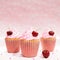 3d render of three cupcakes with swirled icing and cherries