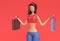 3D Render Woman Holding Shopping Bags Isolated on Red Background