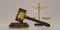 3D render wooden judge gavel with Gold brass balance scale on beige background. Judge hammer icon law gavel. Auction court