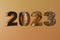 3d render year 2023 made gold metal on golden background